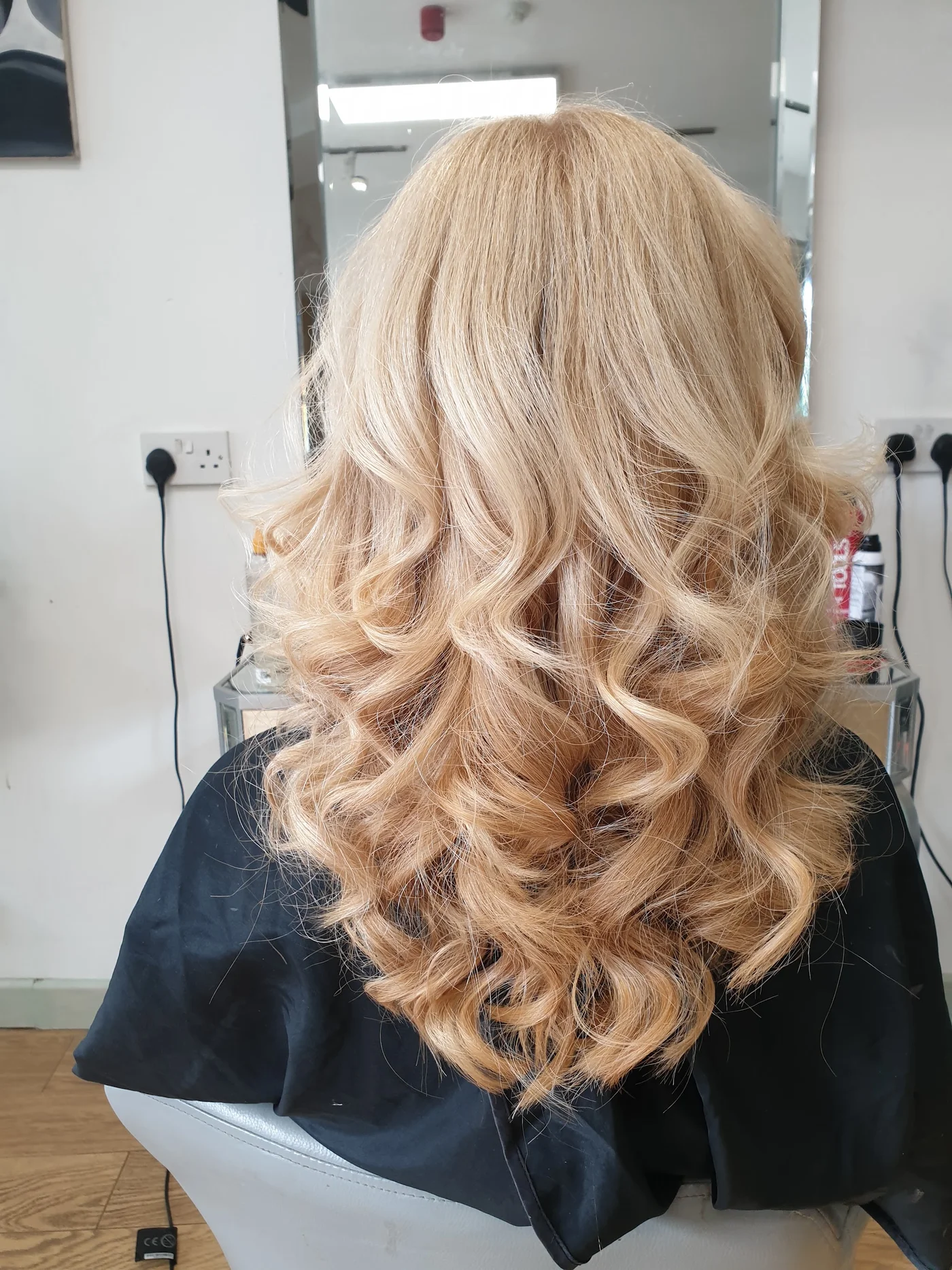 A rear view of blonde curls at Lee and Friends